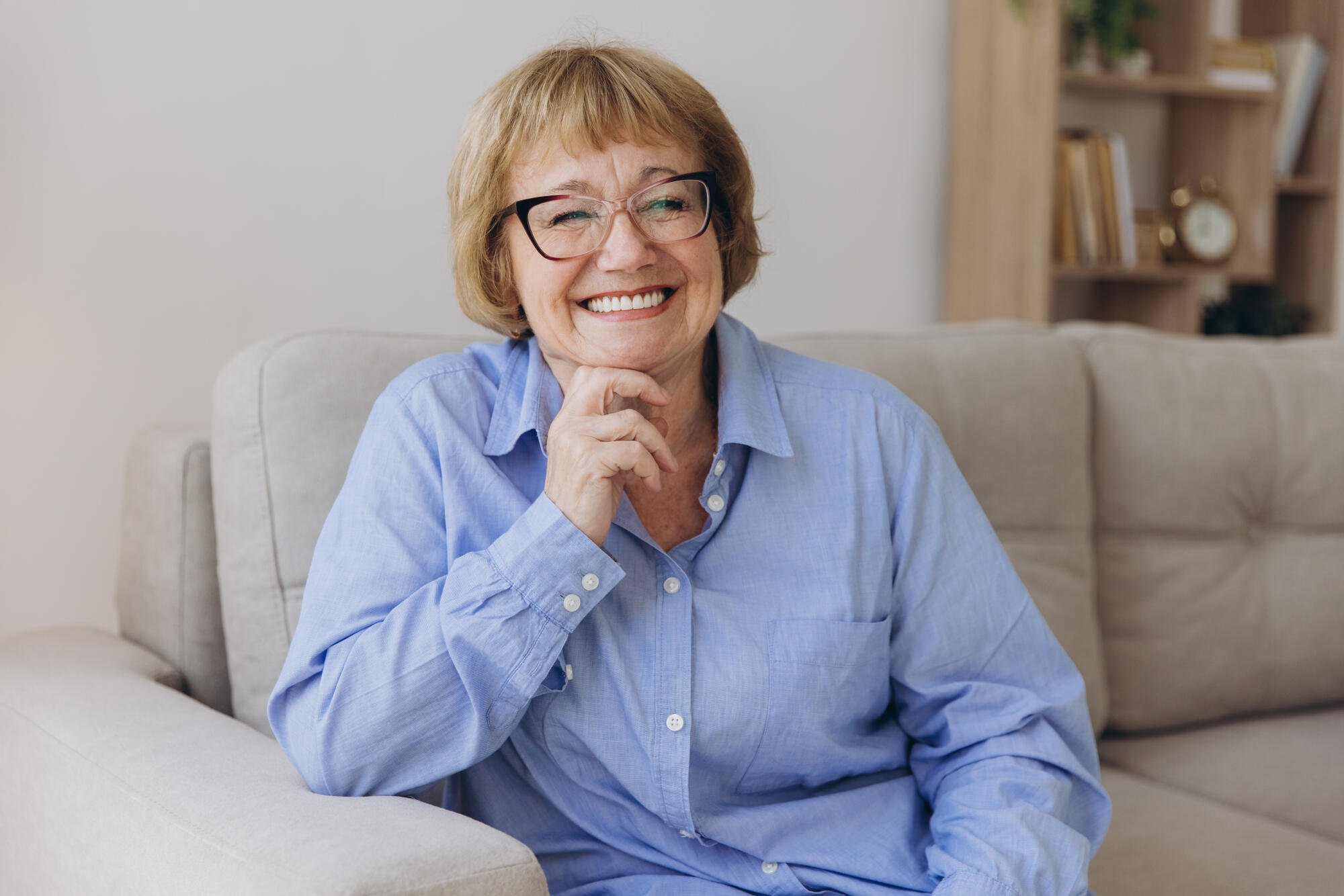 Smiling senior woman on couch